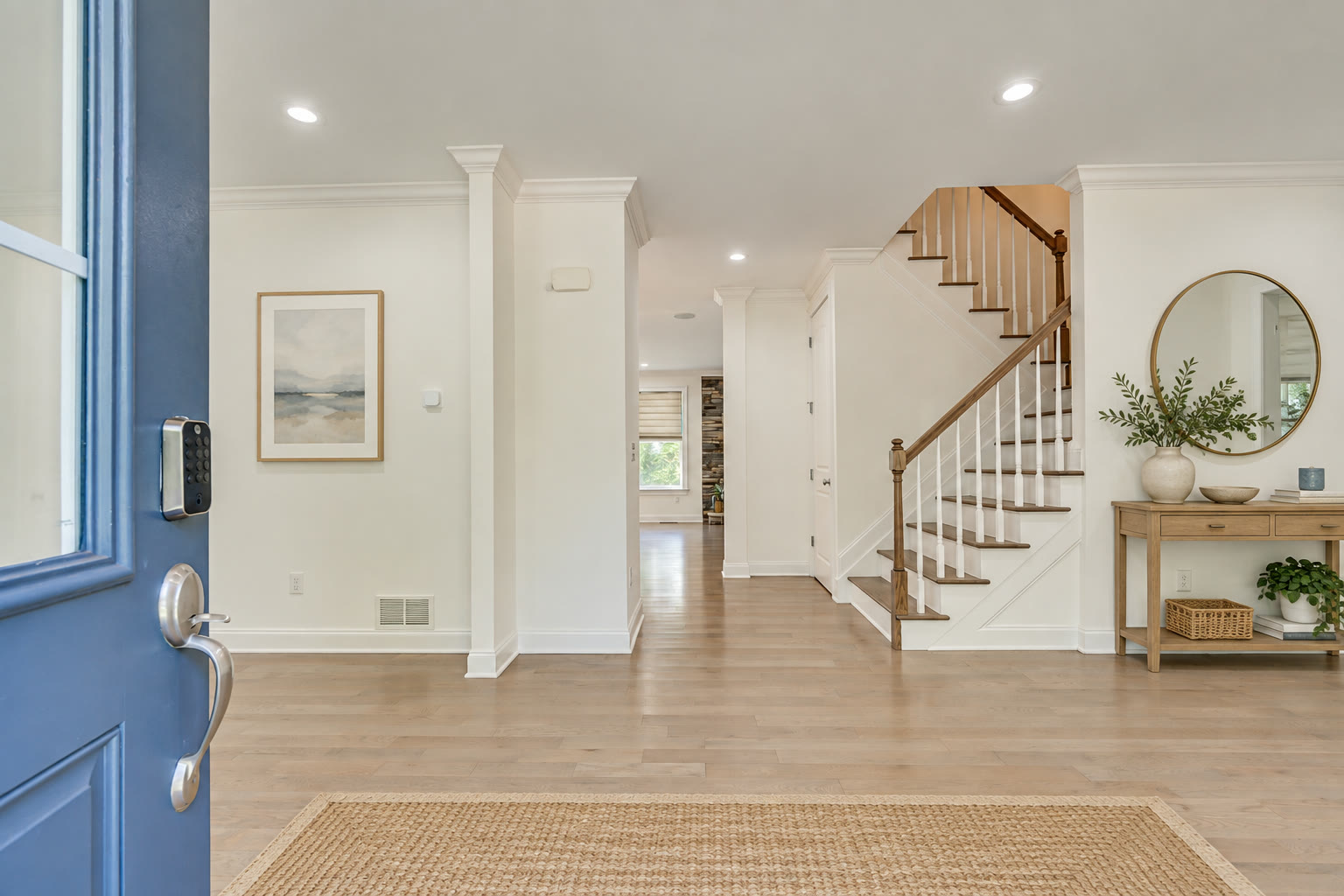 Entrance hall seen from the open blue front door